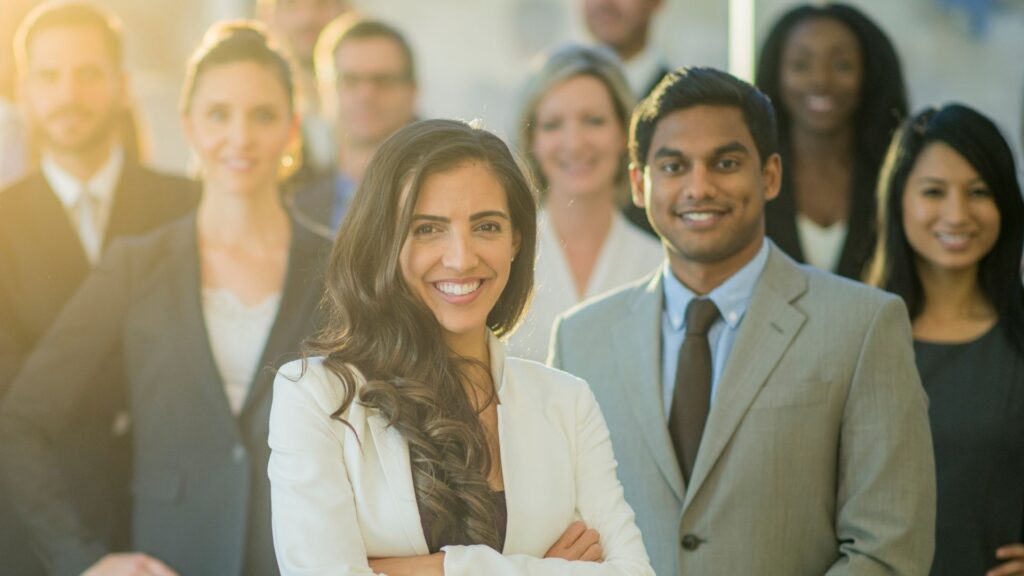 business people smiling and posing in photograph
